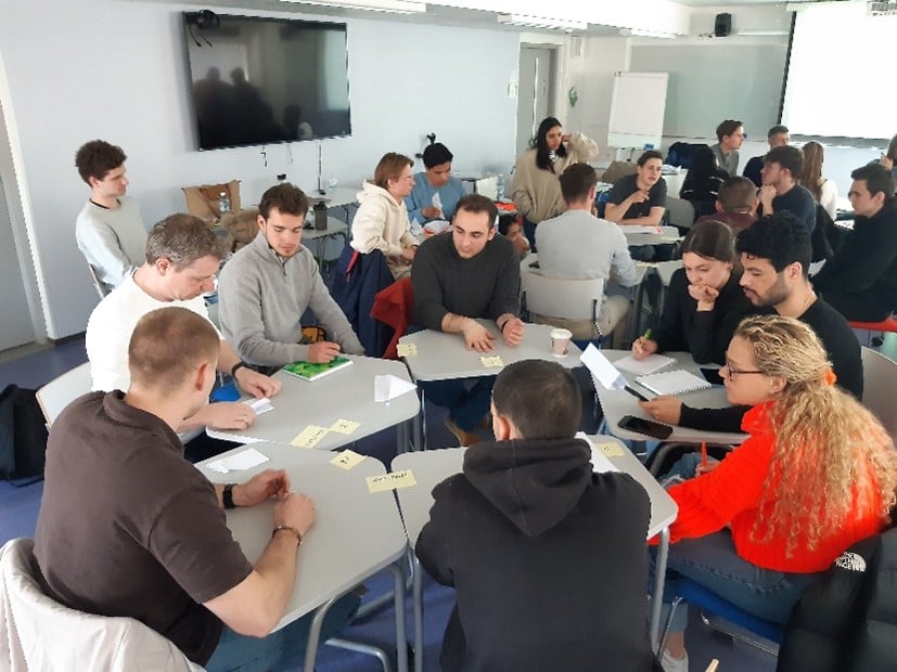 Students sitting around desks