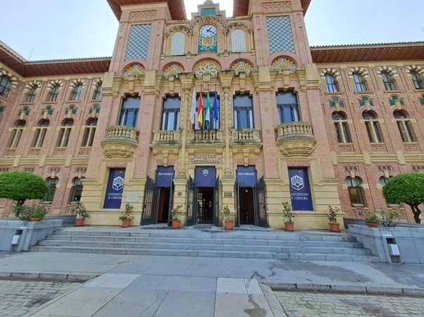 Facade of the building with flagpoles and stairs in front