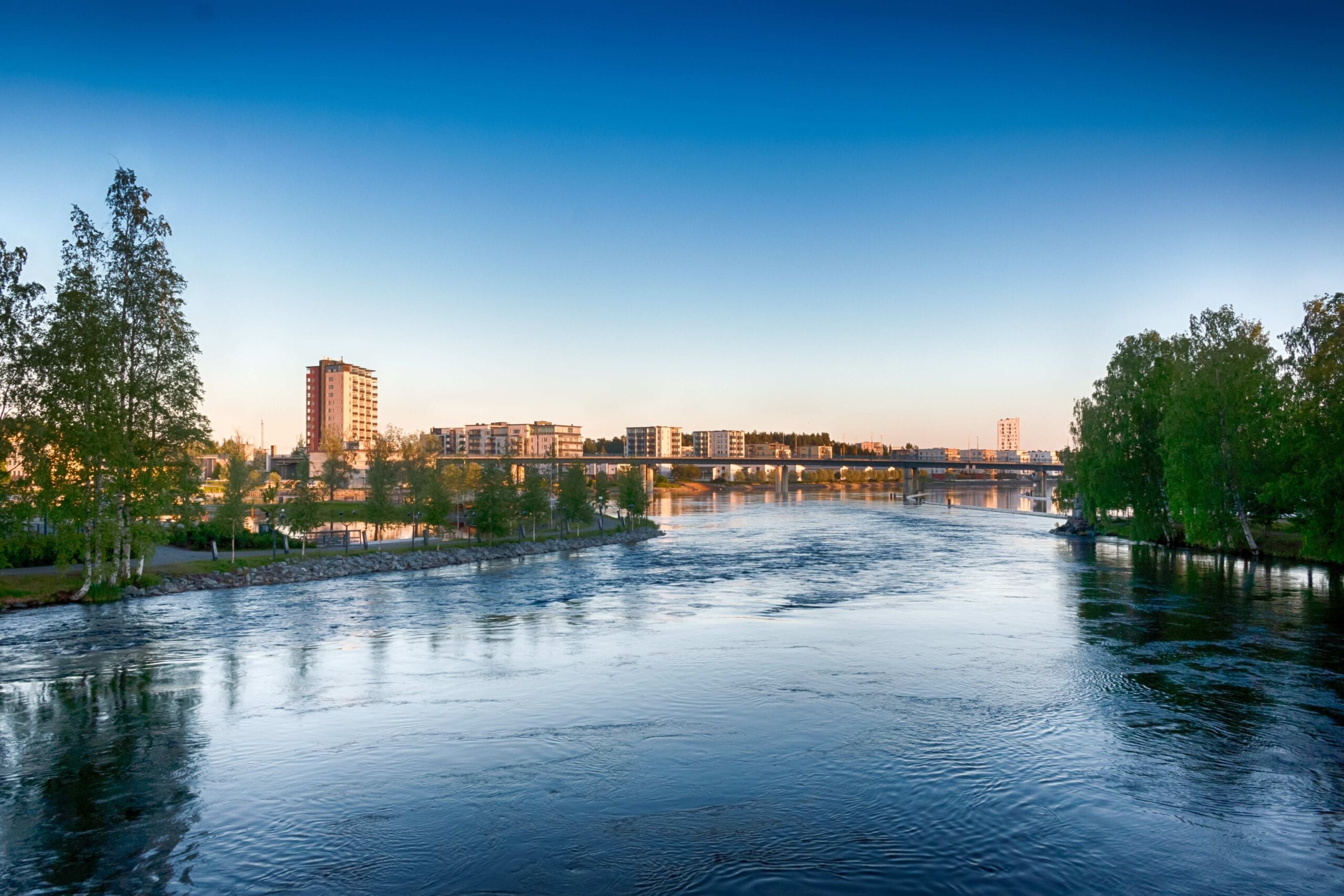 Urban river landscape with apartment blocks