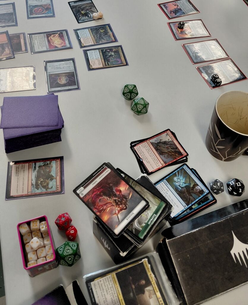 Table with board game cards and dices
